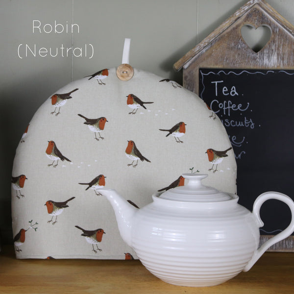 Sophie Allport tea cosy. Handmade by Harris and Home in animal print dog bees and birds fabric