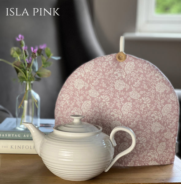 Country linen fabric tea cosy in floral print in peony pink.