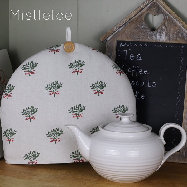 Christmas tea cosy. Handmade in Sophie Allport Christmas Fabrics. Robin, Mistletoe Owl Holly Christmas fabric.