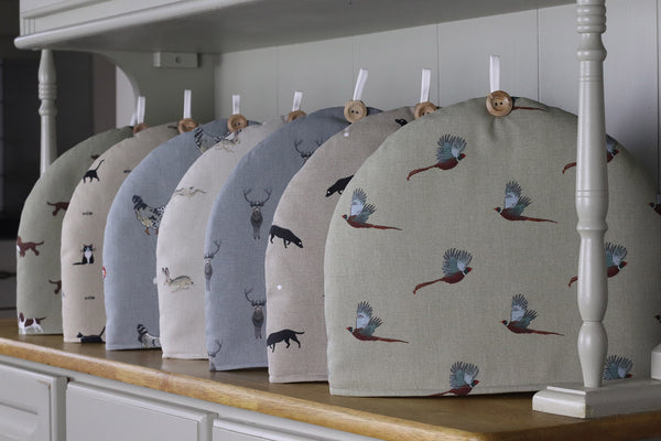 Sophie Allport tea cosy. Handmade by Harris and Home in animal print dog bees and birds fabric
