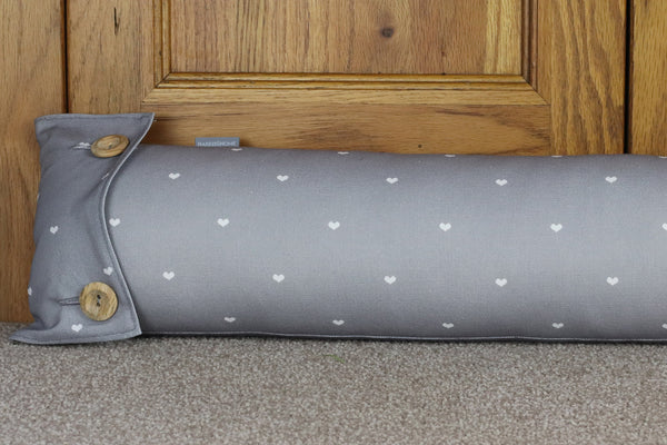 Fabric draught excluder in earl grey polka heart fabric designed by Harris & Home.