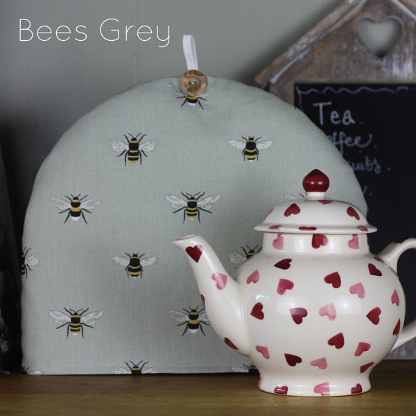 Sophie Allport tea cosy. Handmade by Harris and Home in animal print dog bees and birds fabric