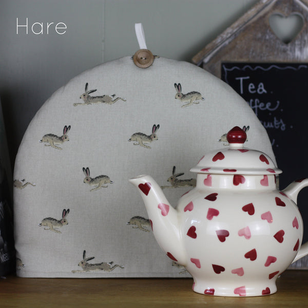 Sophie Allport tea cosy. Handmade by Harris and Home in animal print dog bees and birds fabric