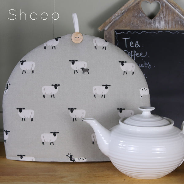 Sophie Allport tea cosy. Handmade by Harris and Home in animal print dog bees and birds fabric